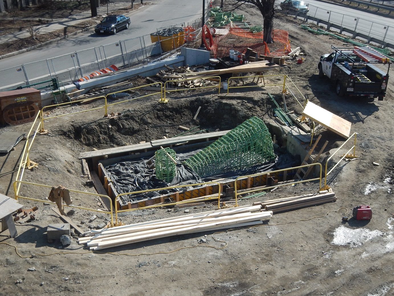 Reinforcing steel and formwork placed in an excavated bridge footing.